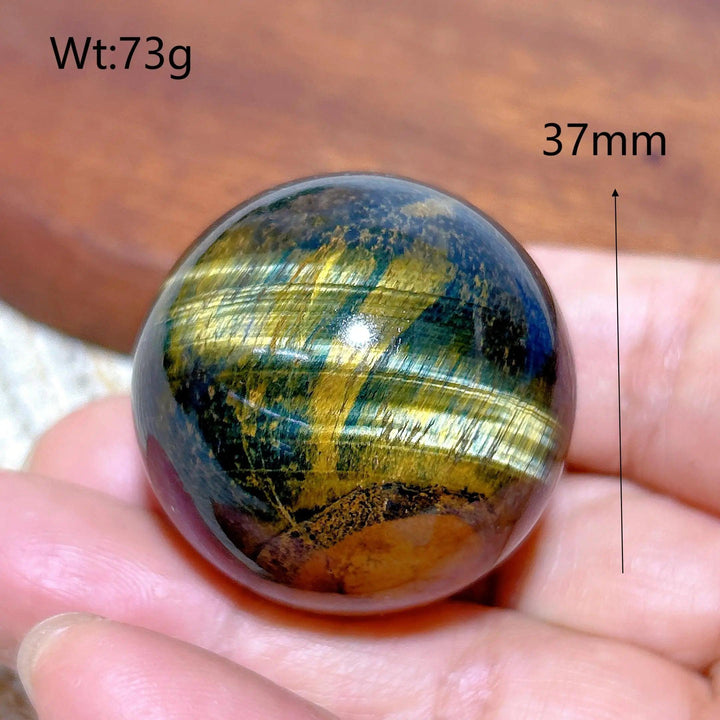 Flashy 37mm Blue and Yellow Tiger Eye crystal sphere, a natural healing stone ornament perfect for Feng Shui decor.