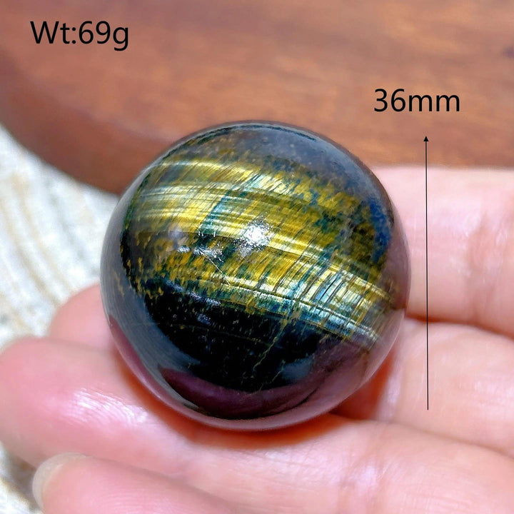 36mm Blue and Yellow Tiger Eye crystal sphere, a flashy polished healing stone ball perfect for energy and home decor.