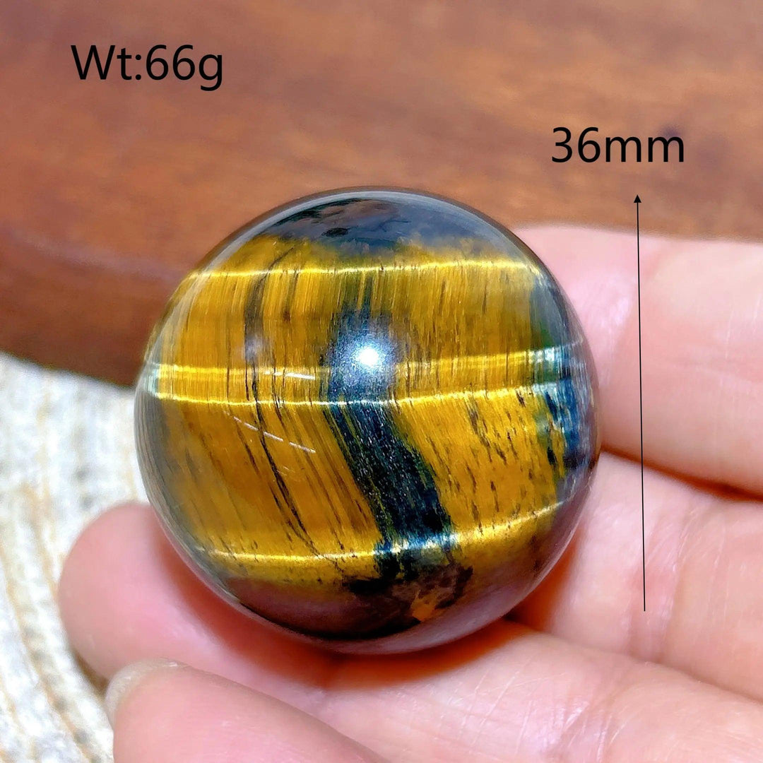 36mm Blue and Yellow Tiger Eye crystal sphere, a polished healing stone ornament with flashy, natural mineral energy.