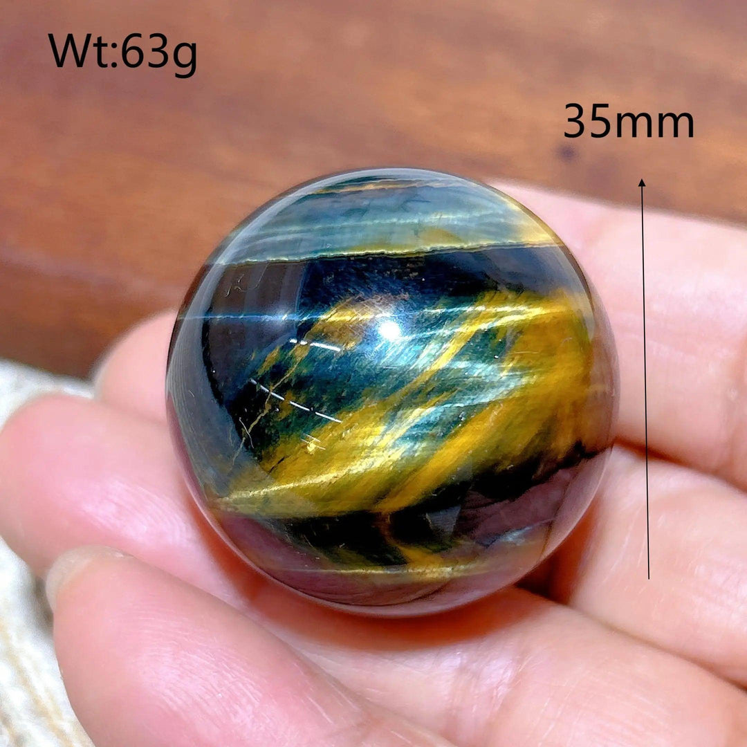 35mm Blue and Yellow Tiger Eye crystal sphere, a flashy healing stone ball perfect for Feng Shui decor and energy gifts.