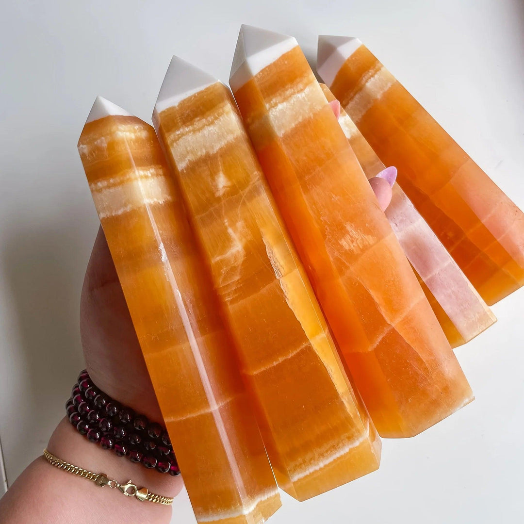 Polished Honey Calcite Crystal Towers with warm golden banding for solar plexus chakra healing.