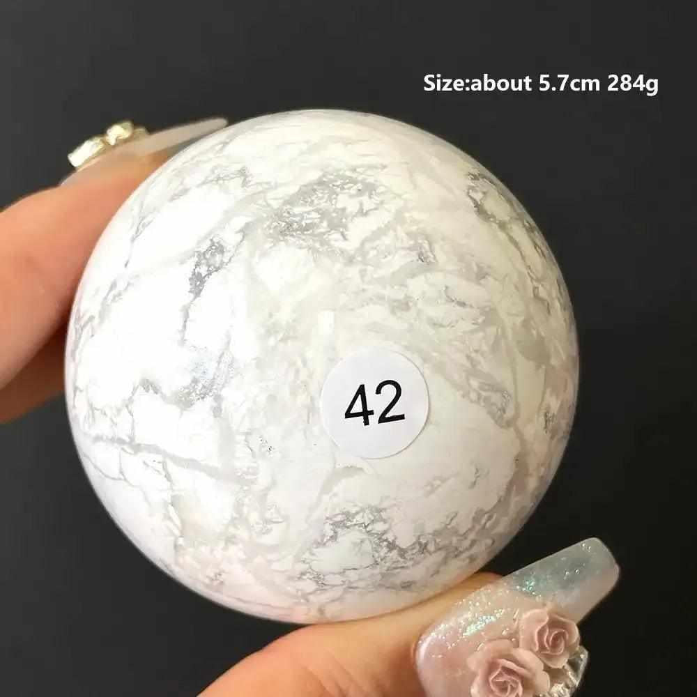 Polished 5.7cm Howlite sphere #42 featuring creamy white stone with delicate gray veining for Crown Chakra balance.