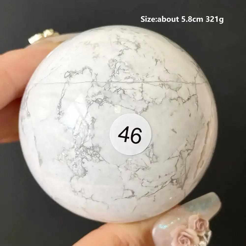 Polished 5.8cm Howlite sphere number 46, featuring creamy white stone with delicate gray veining for calm and balance.