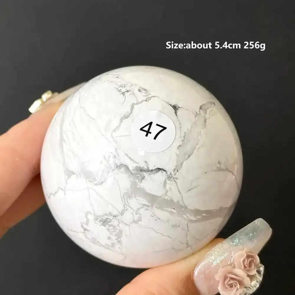 Polished 5.4cm Howlite sphere #47 featuring creamy white stone with delicate gray veining for calm and Crown Chakra balance.