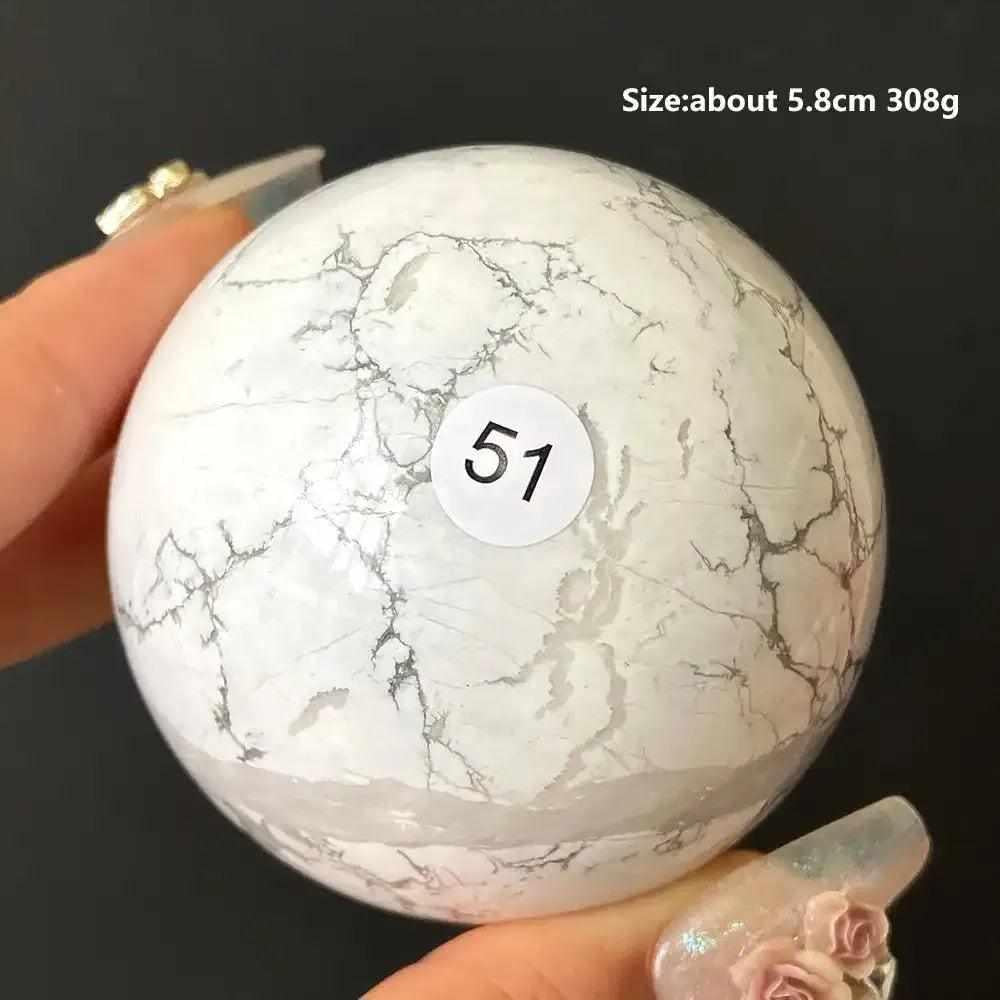 Polished Howlite sphere number 51, a creamy white crystal with delicate gray veining for calm, balance, and meditation.