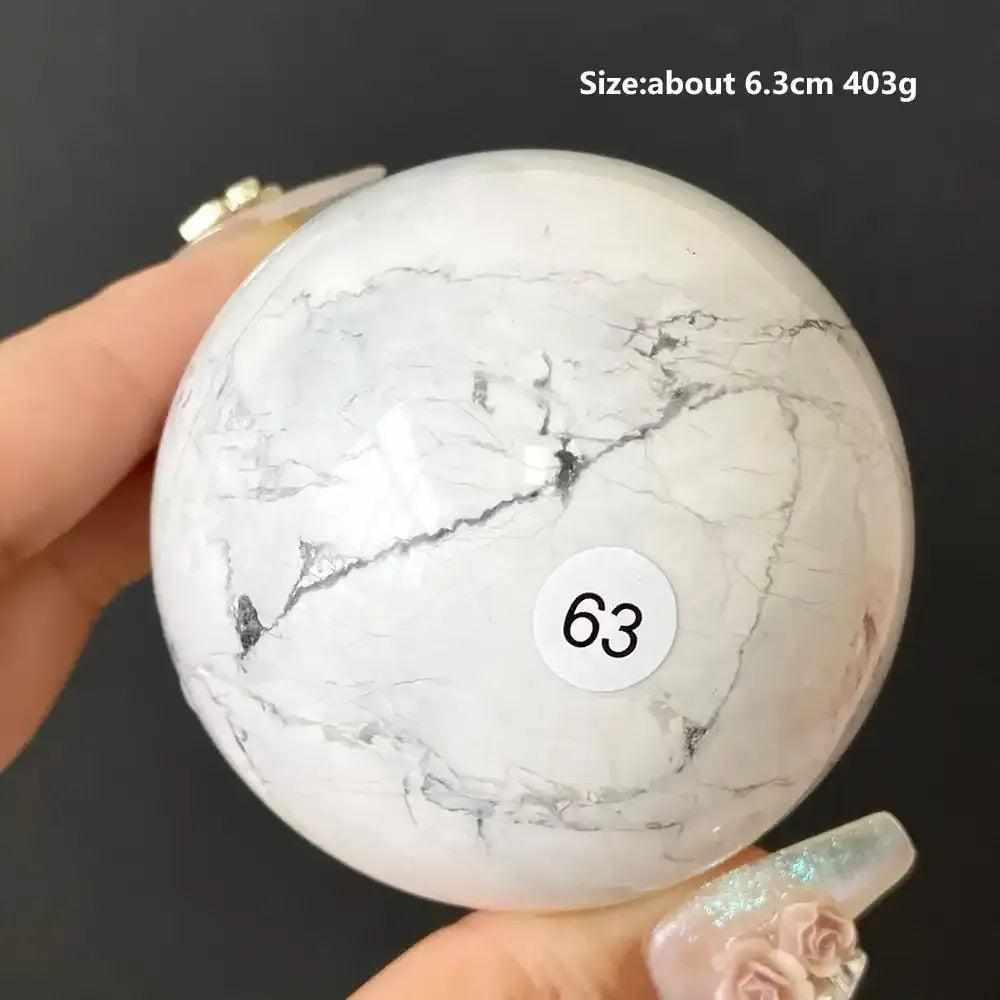Polished 6.3cm Howlite sphere, style 63, featuring creamy white stone with delicate gray veining for calming meditation.
