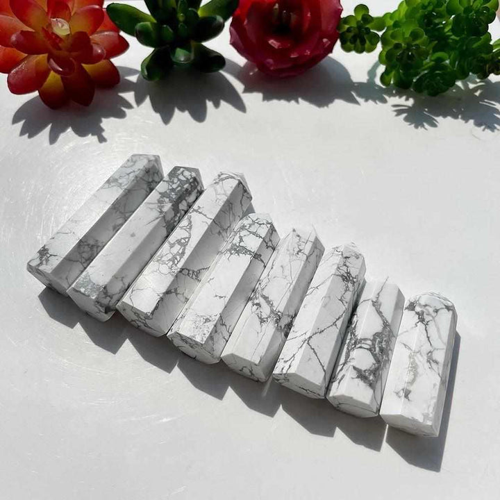 Polished Howlite Tower Points featuring soft white stone with unique gray veining for calm, crown chakra energy.