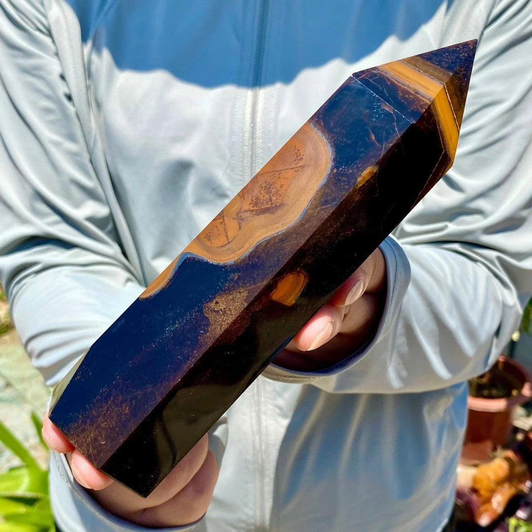 Polished Yellow Tiger's Eye obelisk crystal wand featuring rich golden-brown bands for healing and natural energy.