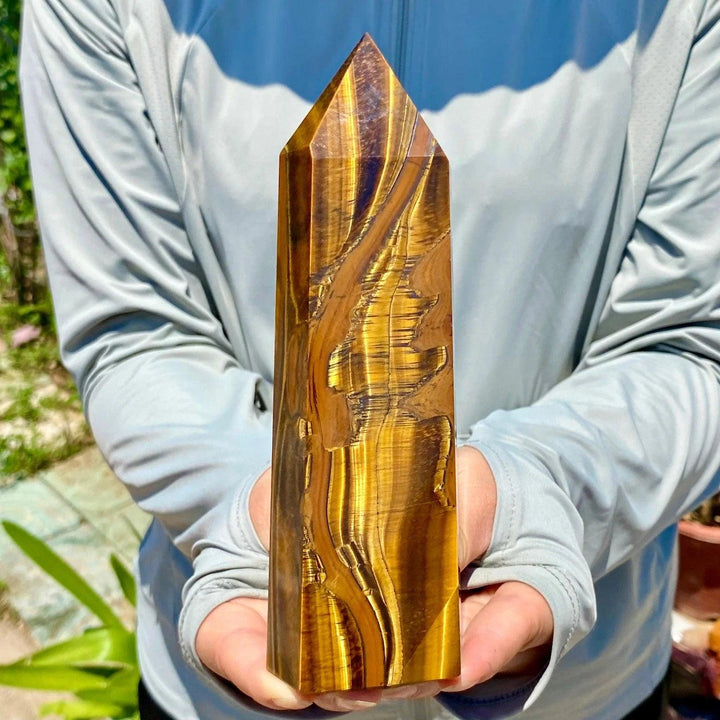 Polished yellow Tiger's Eye obelisk crystal wand featuring natural golden bands for healing and energy balancing.
