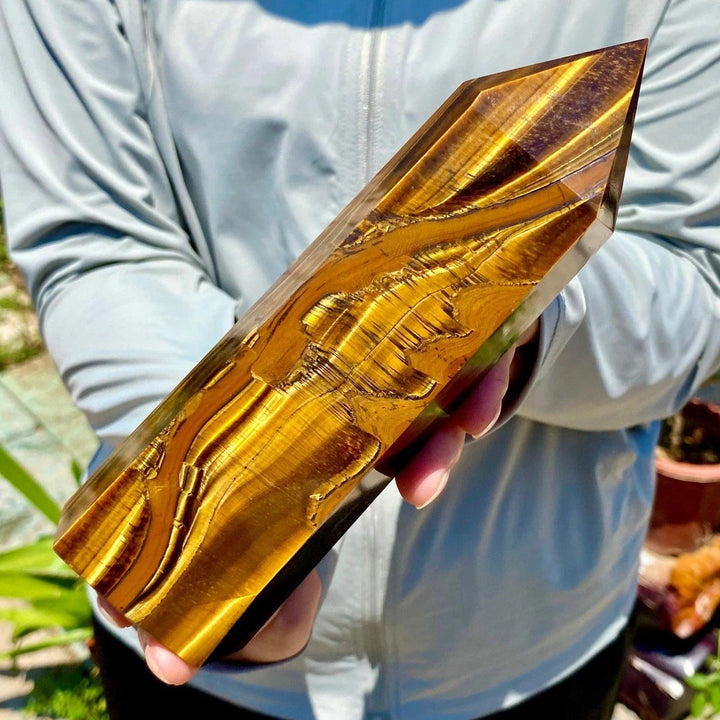Polished yellow Tiger's Eye obelisk crystal wand with golden chatoyant bands for healing and energy balancing.