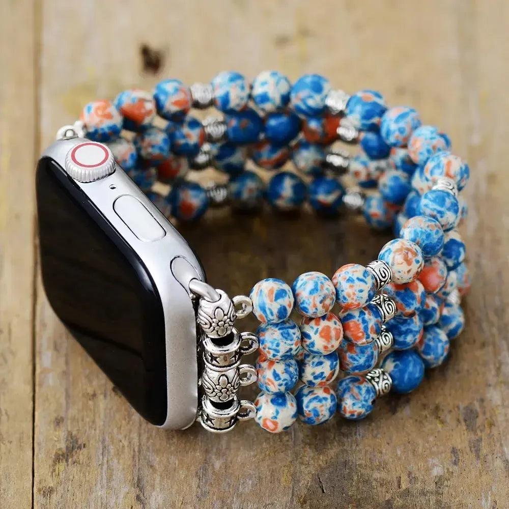 Imperial Jasper Apple iWatch band by Crystal Destiny. Blue, orange, and white beaded elastic band with silver accents.