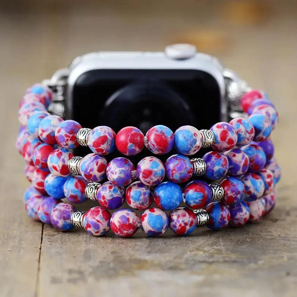 Crystal Destiny Imperial Jasper Apple Watch band with vibrant red, blue, and purple beads, 38-49mm elastic.