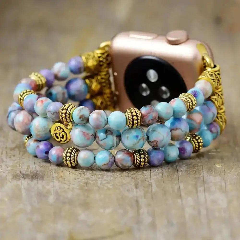 Imperial Jasper Beaded Strap Apple Watch Band with calming blue, purple, and earthy tones, gold accents, and Om charm.