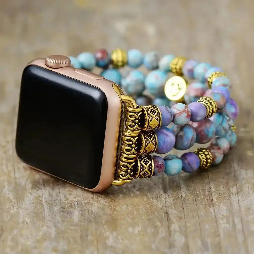 Imperial Jasper Beaded Strap Apple Watch Band with earthy blue, purple, and pink stones, gold accents, and a rose gold watch.