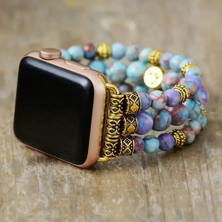 Imperial Jasper Beaded Strap Apple Watch Band with earthy blue, purple, and pink stones, gold accents, and a rose gold watch.