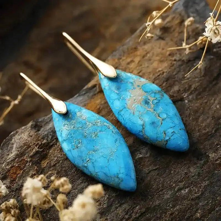 Imperial Jasper Crystal Drop Earrings: Marquise-cut turquoise stones with gold hooks, offering grounding and emotional balance.