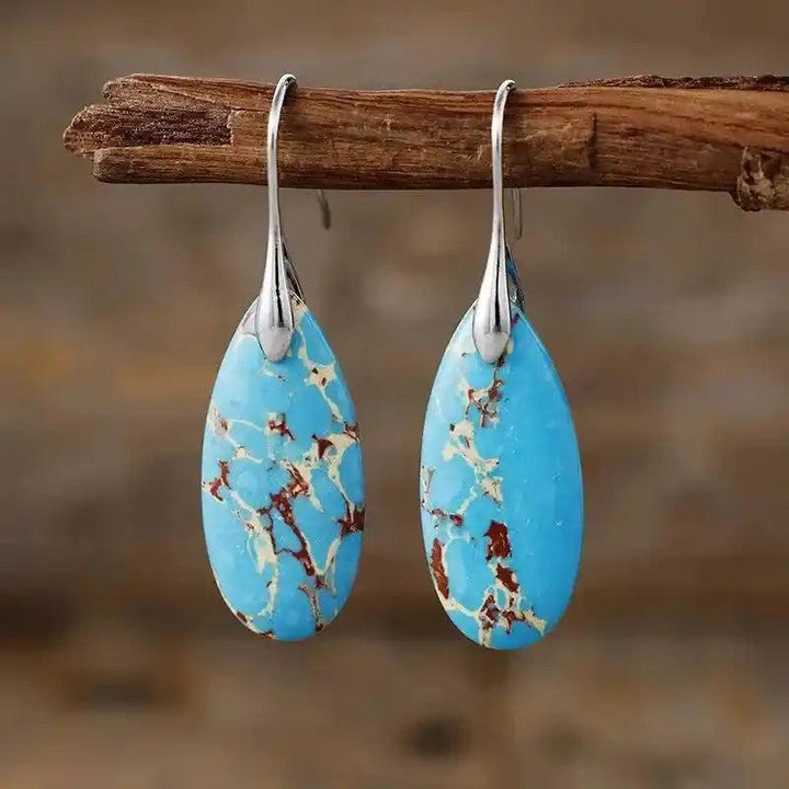 Imperial Jasper Teardrop Earrings: Blue imperial jasper dangles with brown veins, promoting grounding and tranquility.