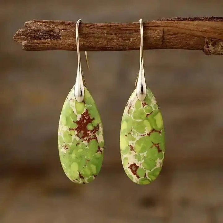 Crystal Destiny Imperial Jasper teardrop earrings with green, brown, and cream patterns, promoting grounding and tranquility.