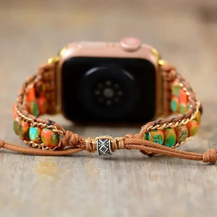 Bohemian Imperial Jasper Apple Watch band by Crystal Destiny, featuring vibrant orange and green stones on a brown rope.