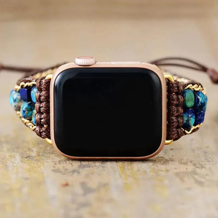 Rose gold Apple Watch with a bohemian wrap band featuring blue and green Imperial Jasper beads from Crystal Destiny.