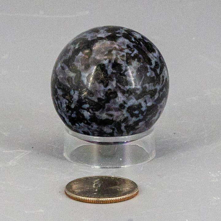 Polished Indigo Gabbro Sphere 40mm, deep blue-black with white & indigo mineral inclusions, galaxy-like surface.
