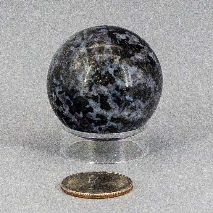 Indigo Gabbro Sphere 40mm, a deep blue-black stone with white, grey, and indigo galaxy-like patterns.