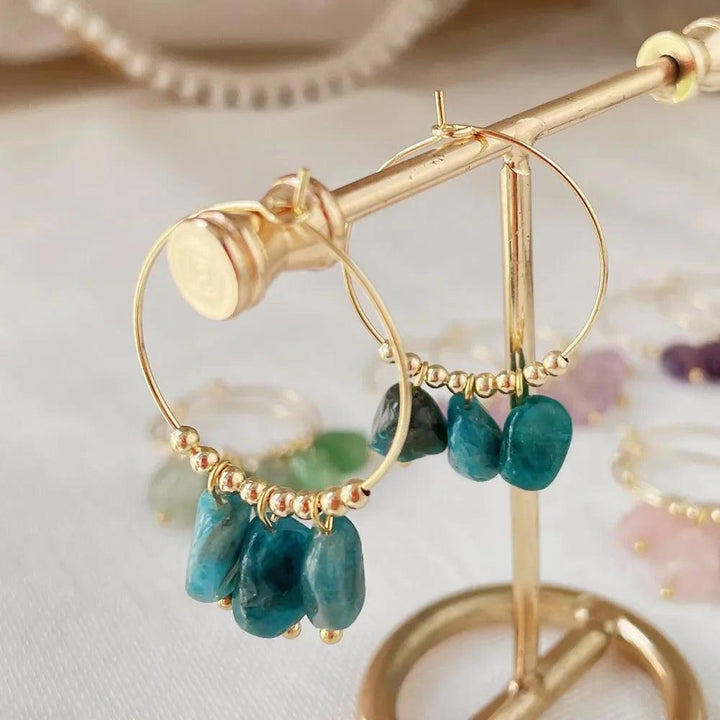 Irregular Apatite Crystal Stone Dangle Hoop Earrings: Gold hoops with raw, blue-green Apatite stones for Throat Chakra.