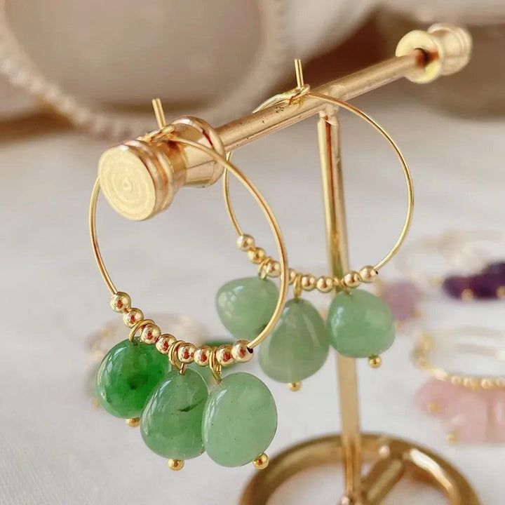 Irregular Green Aventurine Crystal Stone Dangle Hoop Earrings for Women, featuring natural, unpolished green stones on gold hoops.