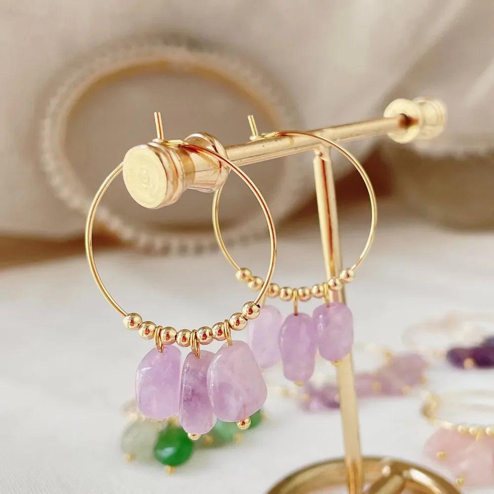 Irregular Amethyst Crystal Stone Dangle Hoop Earrings for Women, featuring raw purple stones on gold hoops.