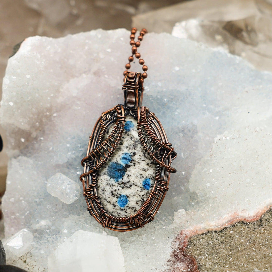 K2 Jasper Wire Wrap Crystal Pendant #2: Unique white granite with vivid blue Azurite orbs, handcrafted in healing copper wire.