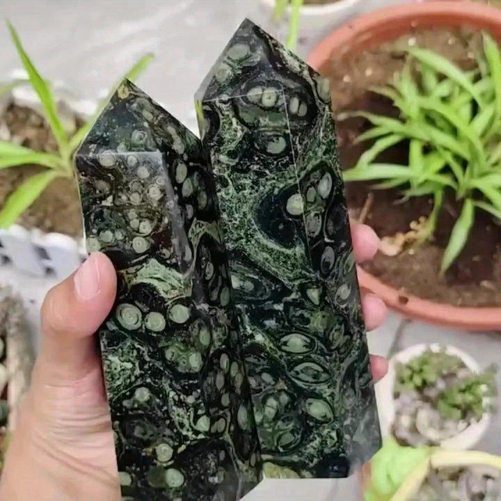 Kambaba Jasper Crystal Point Tower, a grounding hexagonal obelisk with deep green swirls and black orbs.