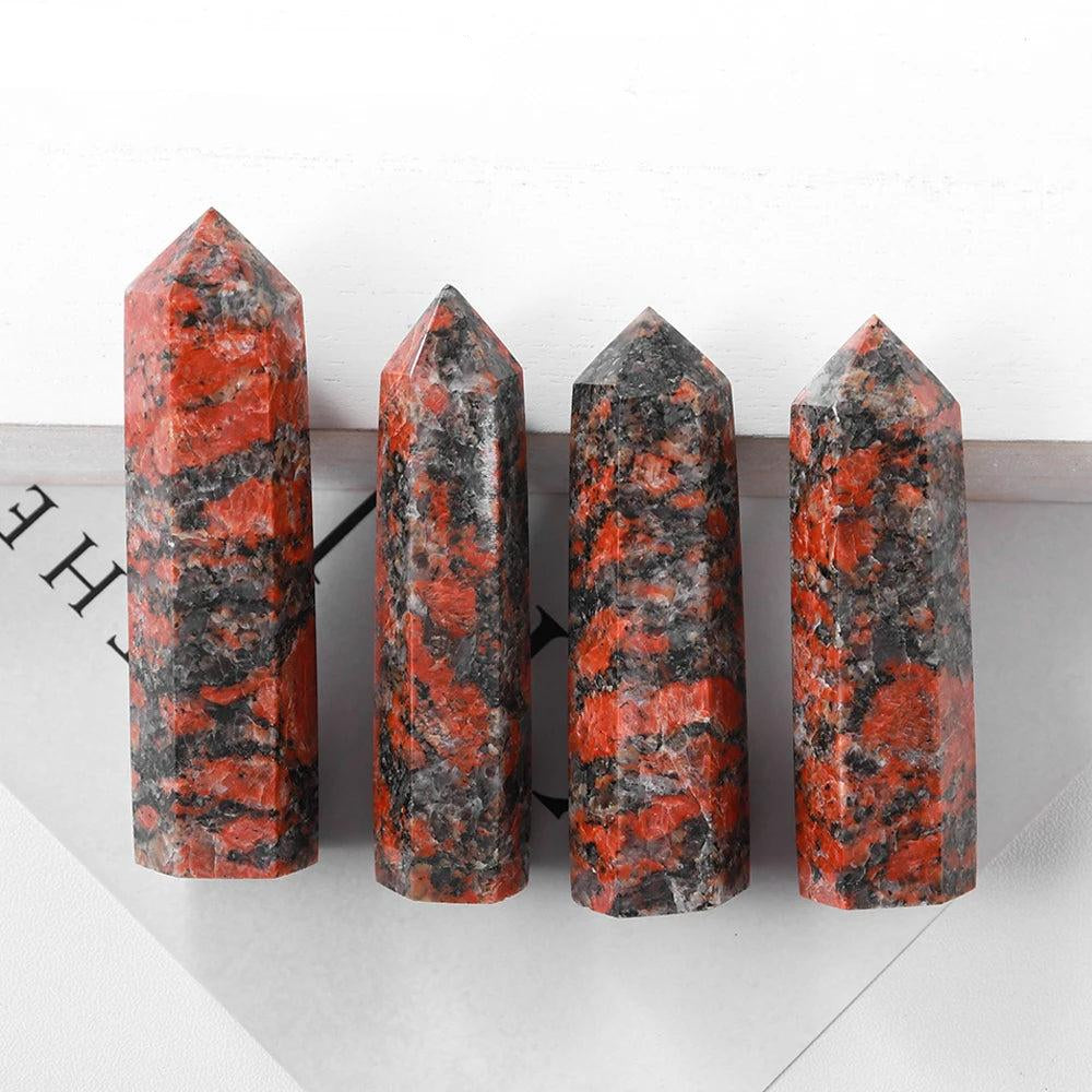 Four polished Katophorite crystal towers with vibrant red and black patterns for energy healing and home decor.