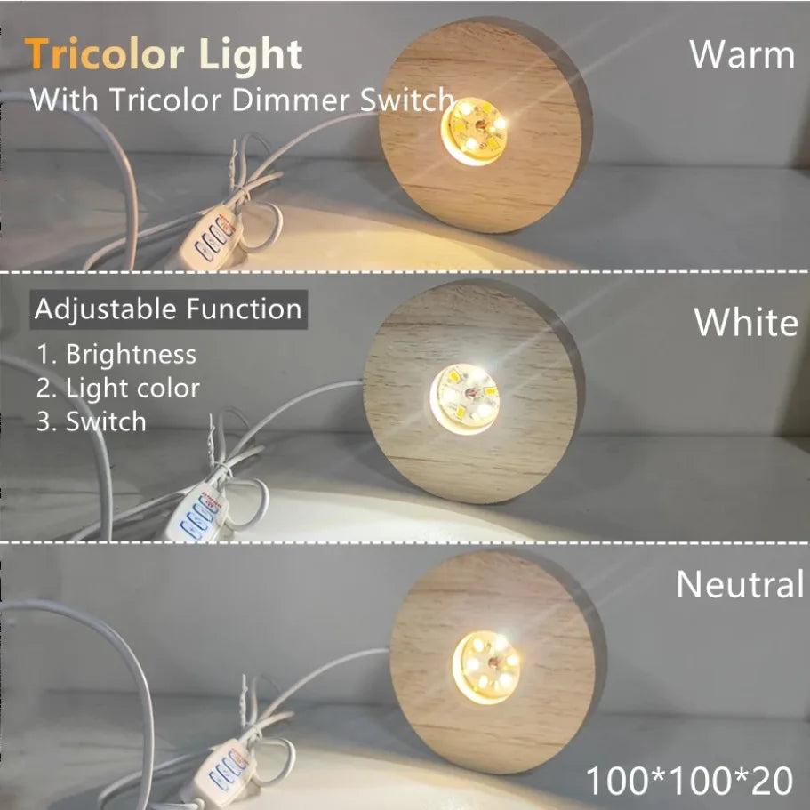 Round wooden LED light base illuminating a crystal sphere with warm, white, and neutral light modes.