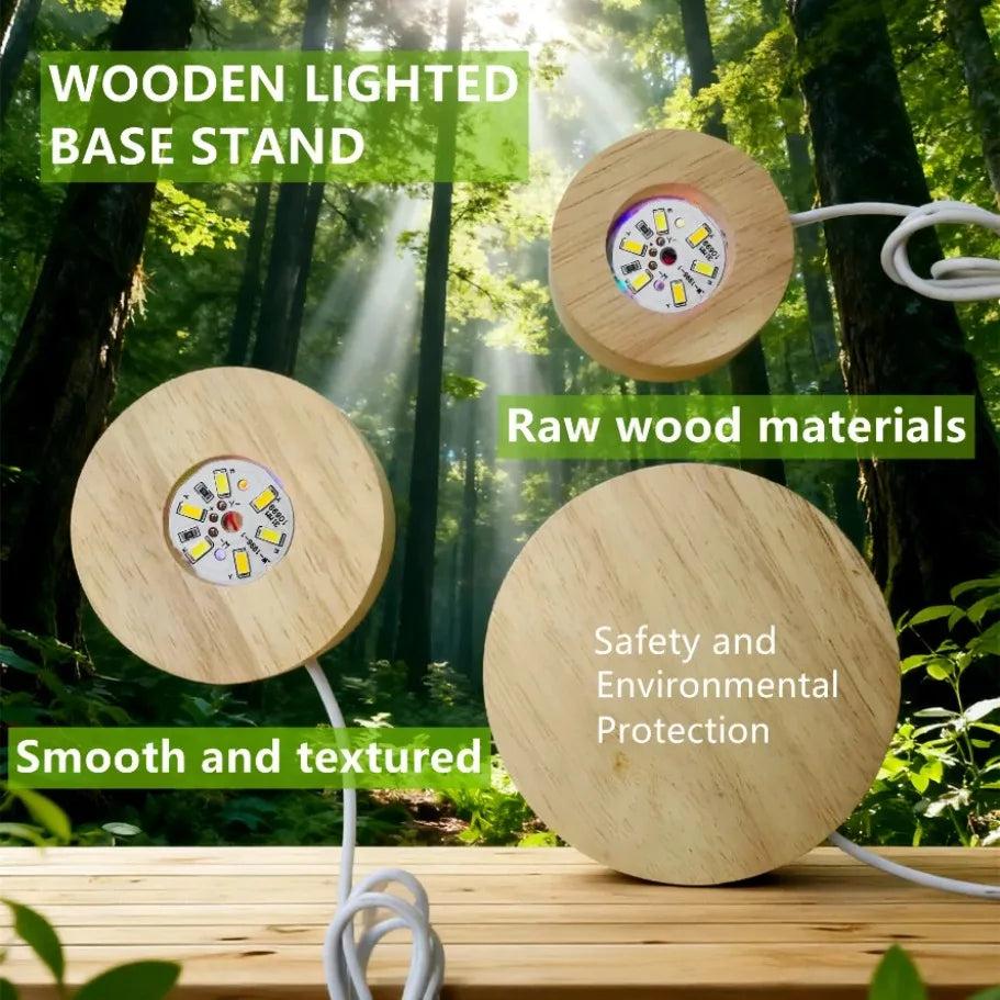 Three round wooden LED light bases with white USB cords, showcasing raw wood texture in a forest setting.