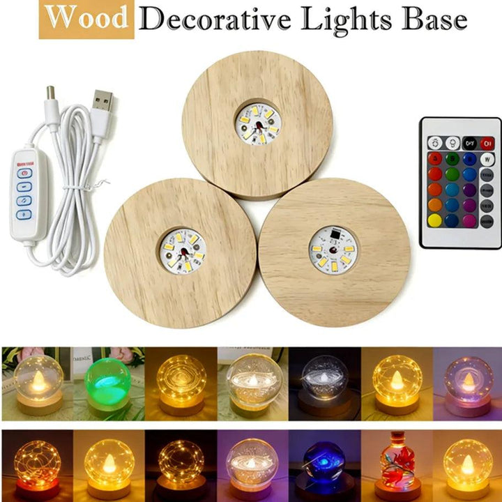 Three round natural wood LED light bases with USB cable and remote, illuminating various crystal spheres.