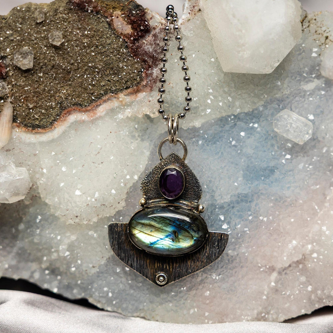 Crystal Destiny's 2.25" Labradorite 925 sterling silver pendant with an amethyst accent, showcasing blue-green labradorescence.