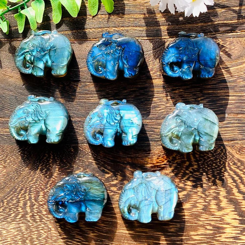 Handmade Labradorite elephant carvings featuring vibrant blue and golden flashes for spiritual healing and home decor.