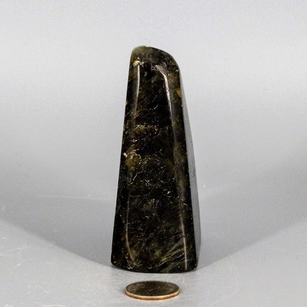Flashy, shimmering Labradorite Freeform Crystal, a dark gray gemstone with natural, uncut silhouette and internal electric blue flash.