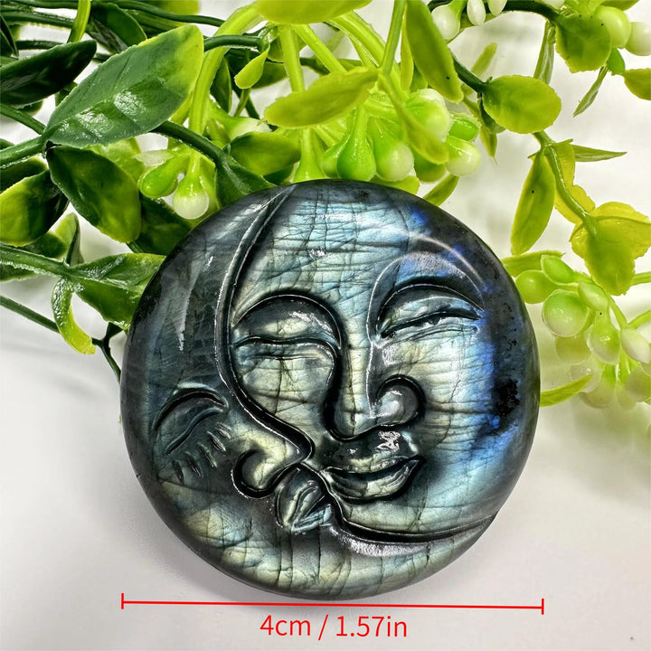 Shimmering labradorite crystal moon and sun carving, 4cm, displaying iridescent blues and golds for intuition and clarity.