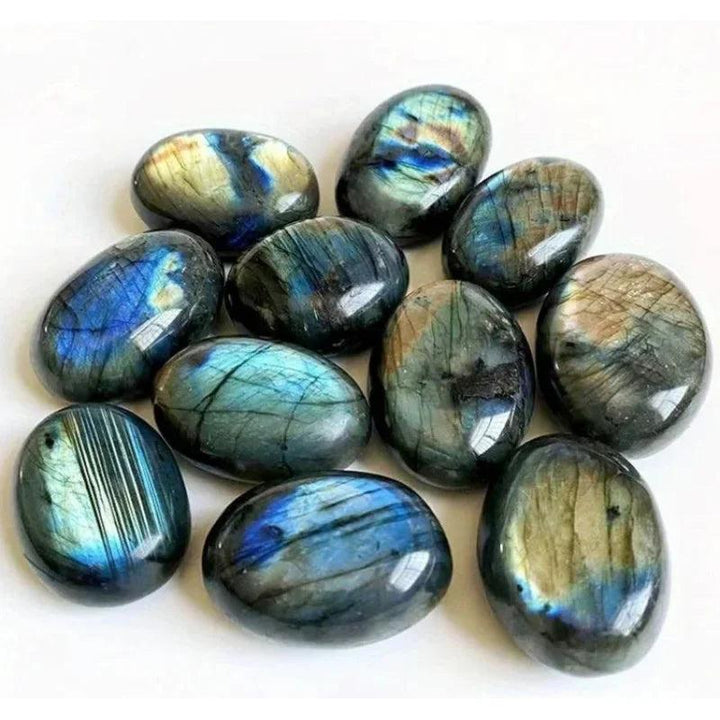 Polished Labradorite Plaything stones with vibrant blue and gold flashes for healing and decor.