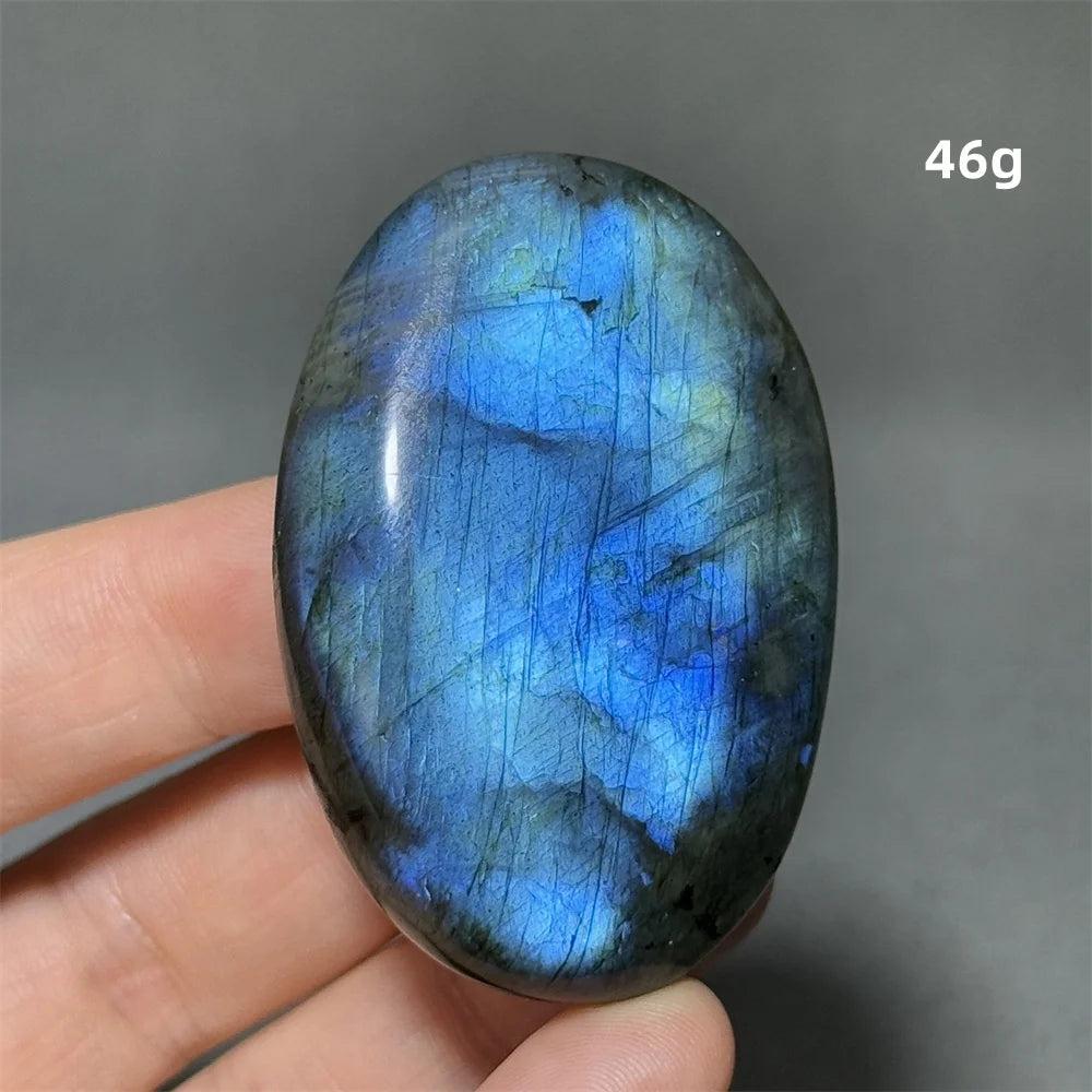 Captivating Labradorite Crystal Polished Palm Stone with vivid blue, gold, and green labradorescence for transformation.