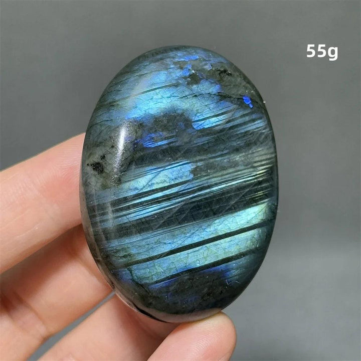 Polished Labradorite Crystal Palm Stone, 55g, showcasing vivid blue, gold, and green labradorescence for protection and growth.