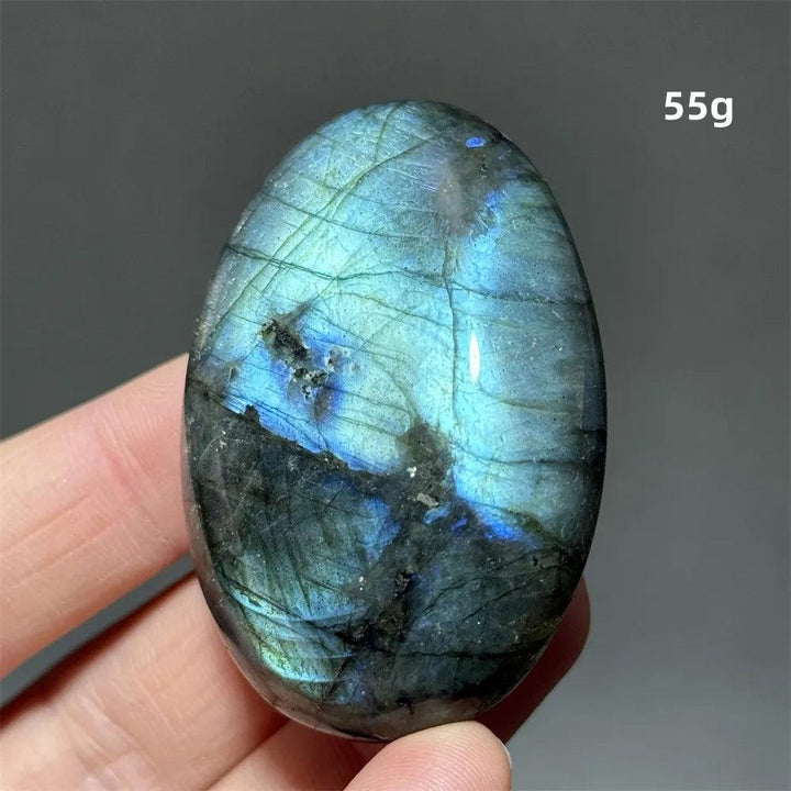 Captivating Labradorite Crystal Polished Palm Stone, 55g, with vivid blue and green labradorescence for transformation.