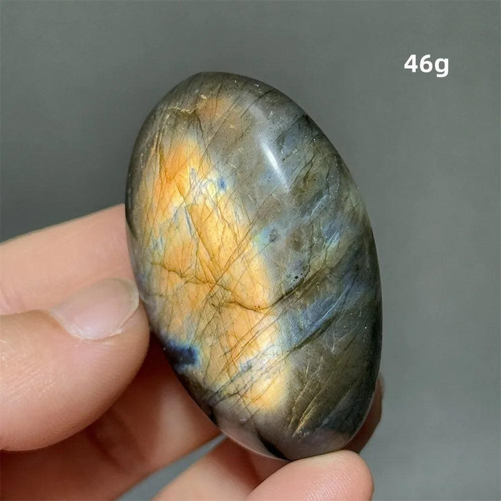 Captivating Labradorite crystal palm stone, polished smooth with vivid blue, gold, and green labradorescence, 46g.