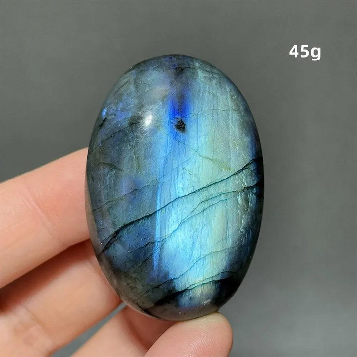 Captivating Labradorite Crystal Polished Palm Stone, 45g, with vivid blue, gold, and green labradorescence.