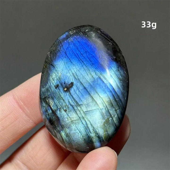 Labradorite Crystal Polished Palm Stone with vivid blue, gold, and green labradorescence, ideal for meditation.