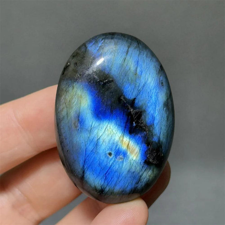 Labradorite Crystal Polished Palm Stone with vivid blue, gold, and green labradorescence for protection and growth.