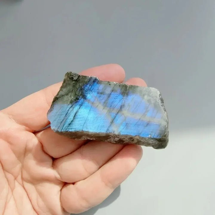 Natural Labradorite crystal rough slice featuring vibrant blue flash for Third Eye and Throat Chakra intuition.