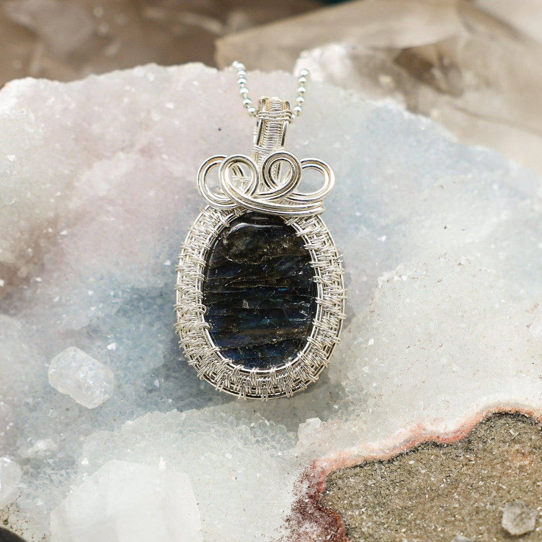 Handcrafted Labradorite Wire Wrap Oval Pendant with shifting blues, greens, and golds in healing copper wire.