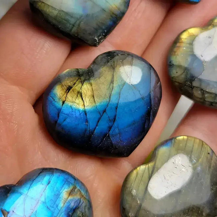 Labradorite heart carving by Crystal Destiny, showcasing iridescent blue and gold flashes.